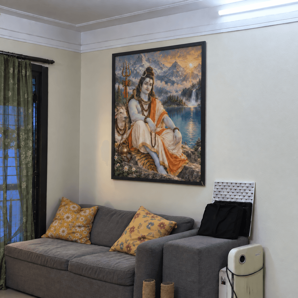 Shiva artwork displayed above a sofa